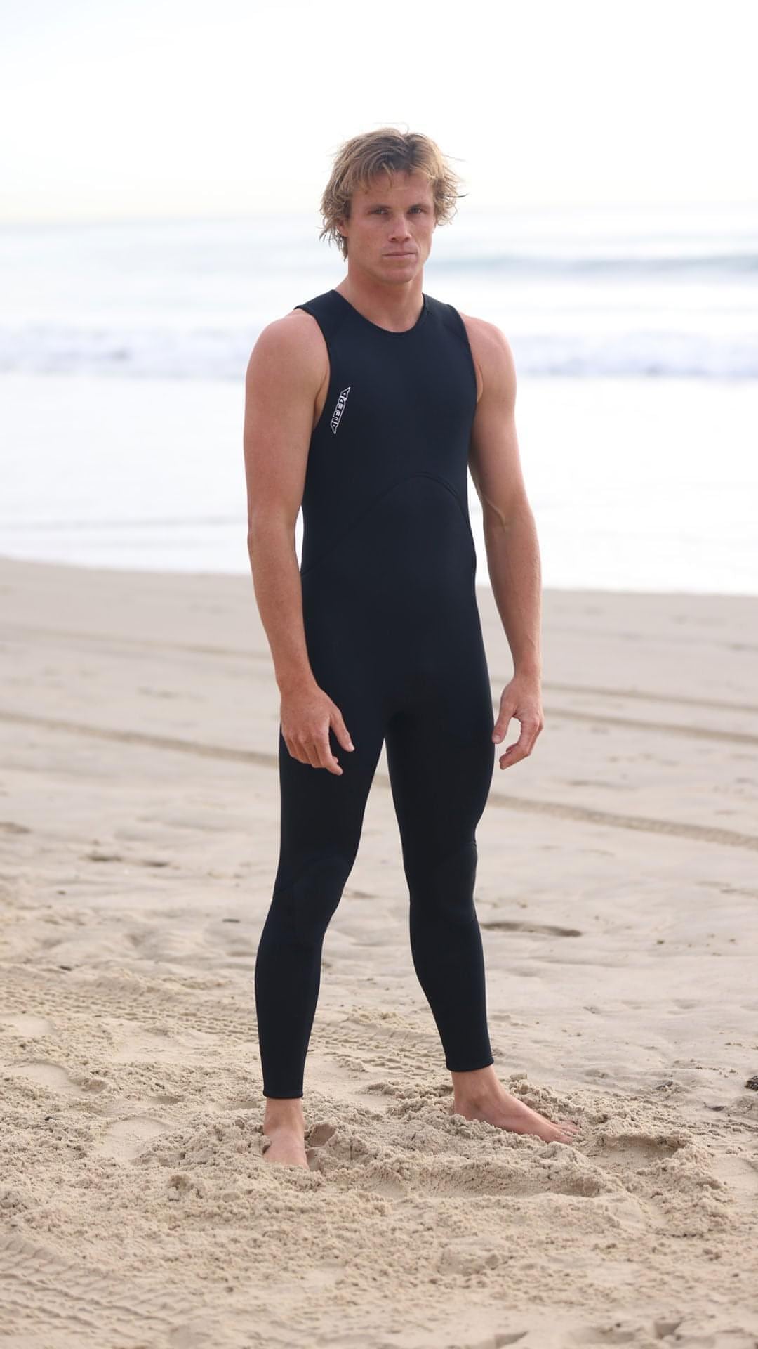 Wetsuit Long John, 2mm, Mens, Adult - front at the beach