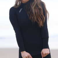 Wetsuit Top, vest, long Sleeve, 2mm, Womens, Adult - hero shot at the beach